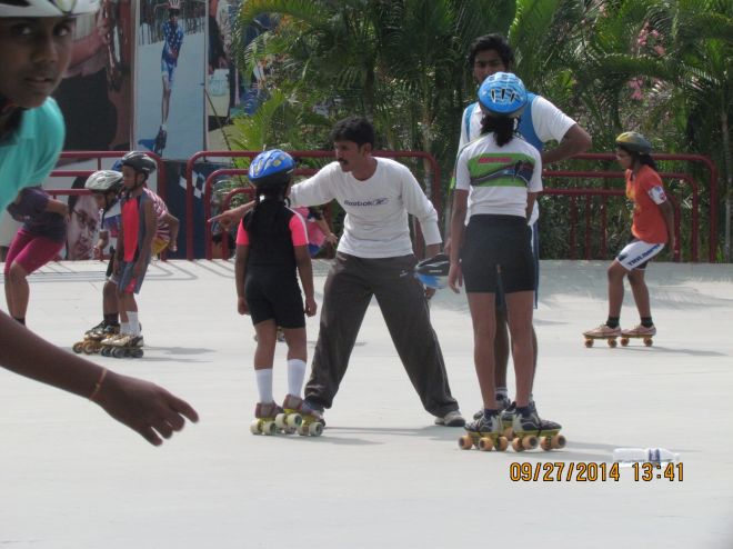 Silver Oaks Coach guiding skaters.